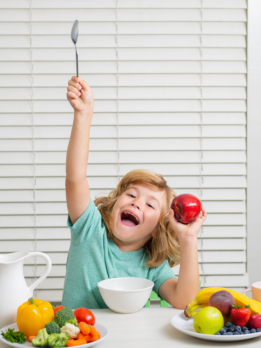 Boy eating fruit