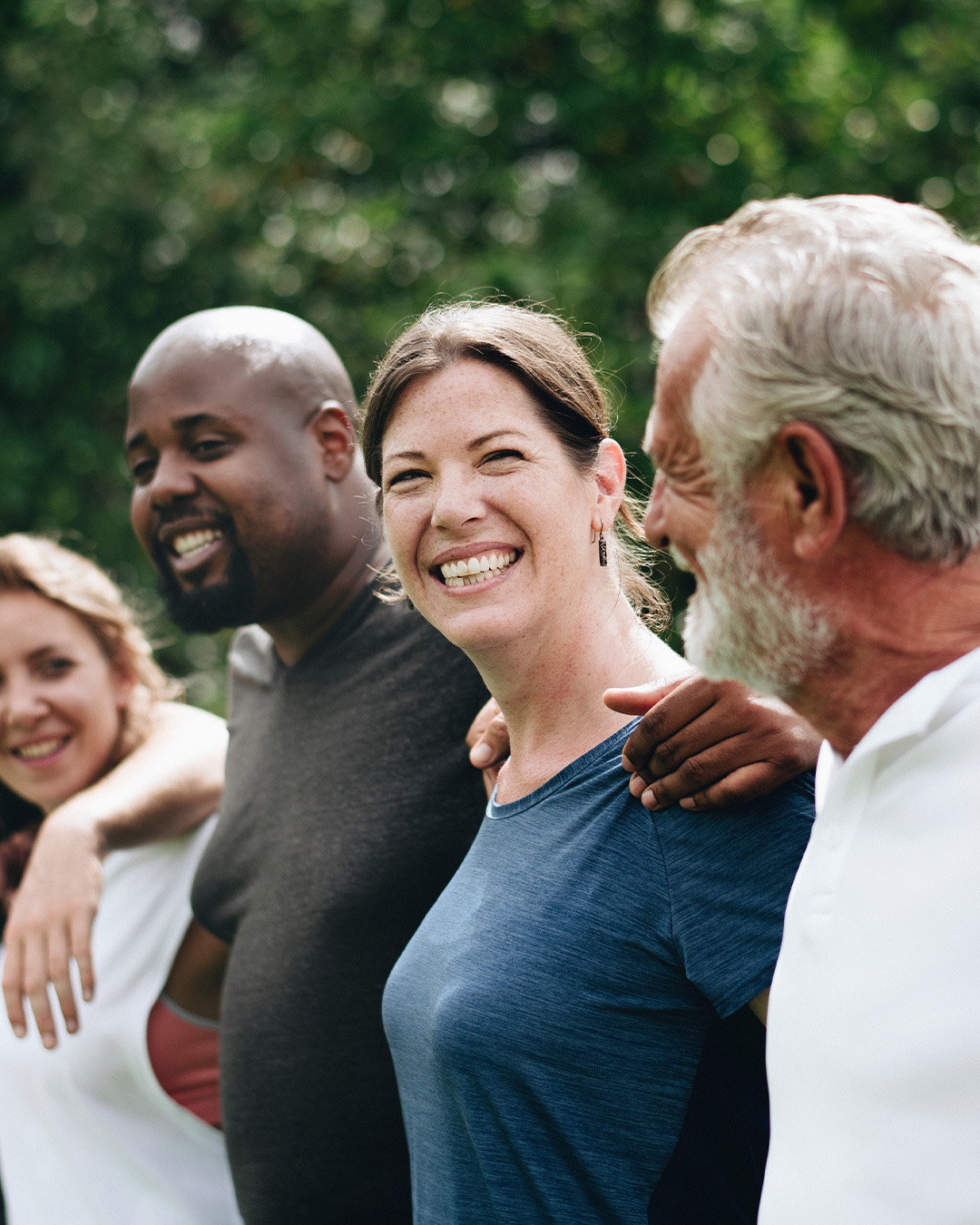 community of people with arms around each other.