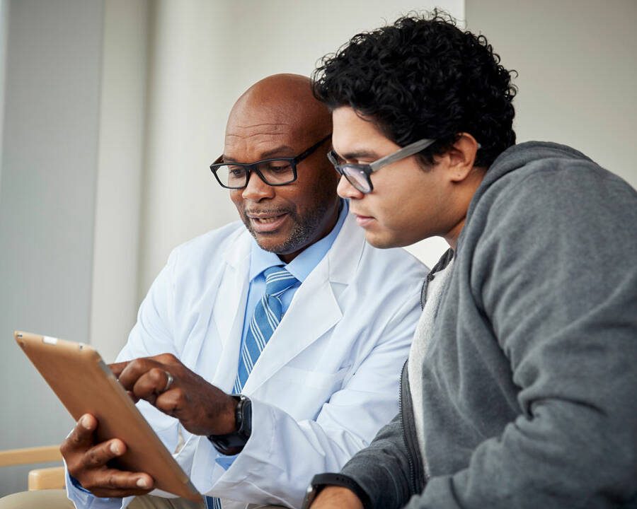 Doctor with teenage patient