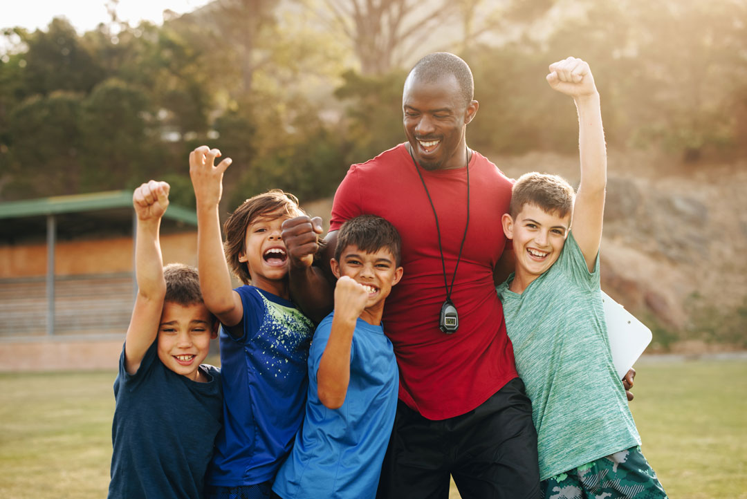 group of kids with coach