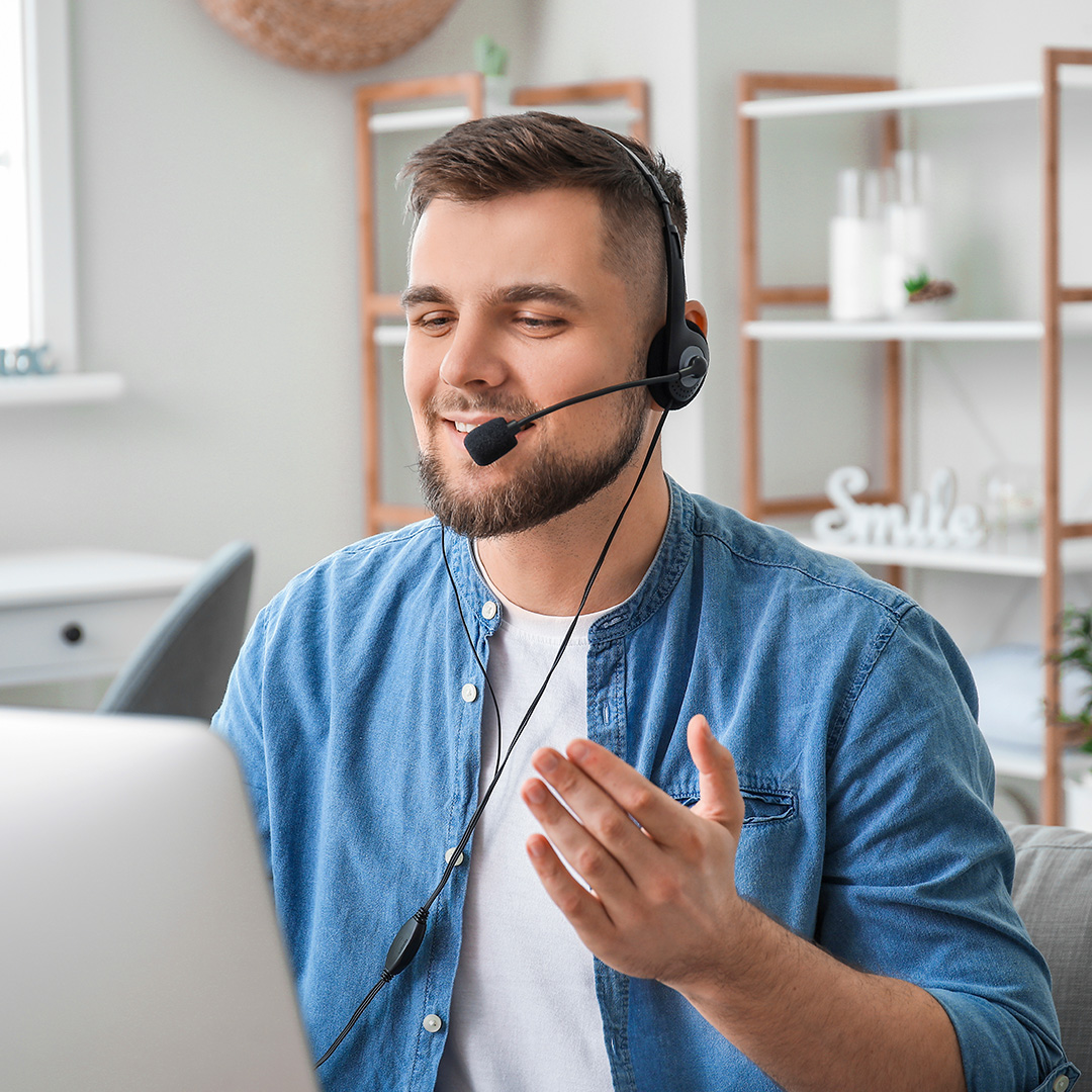 Image of man making a call with a headset