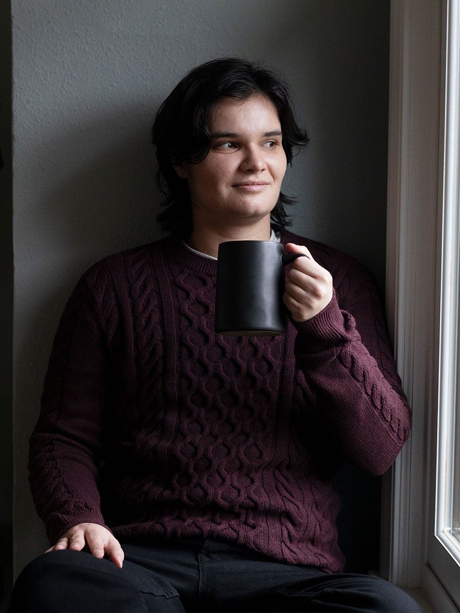 Man looking out at window