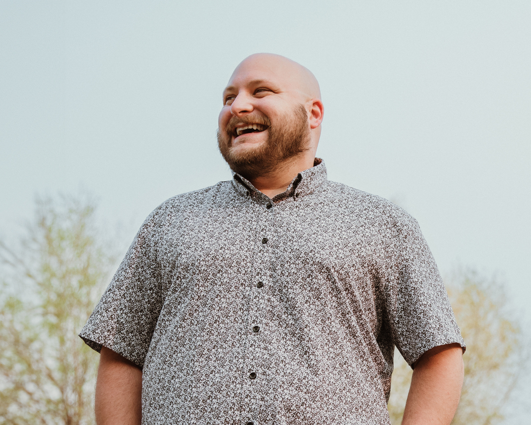 man smiling outdoors