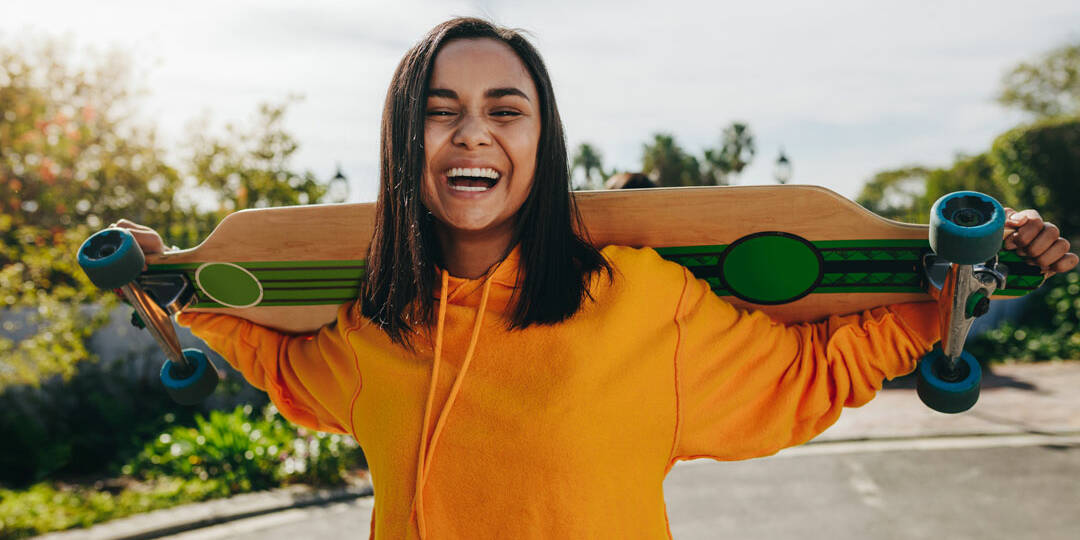 Teenage girl with longboard