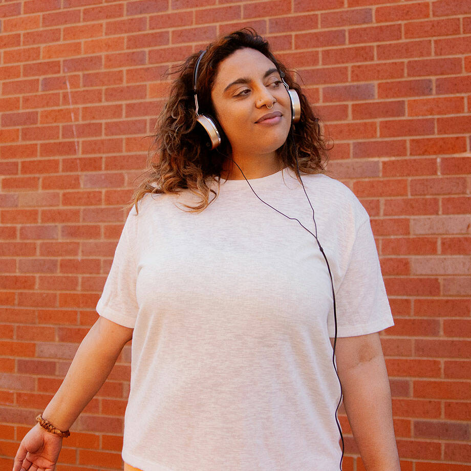 woman listening to music outdoors