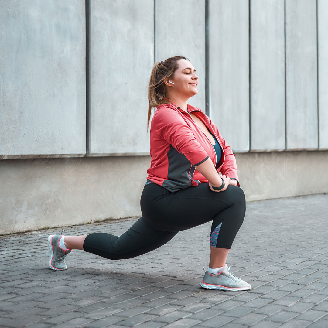 woman stretching and smiling